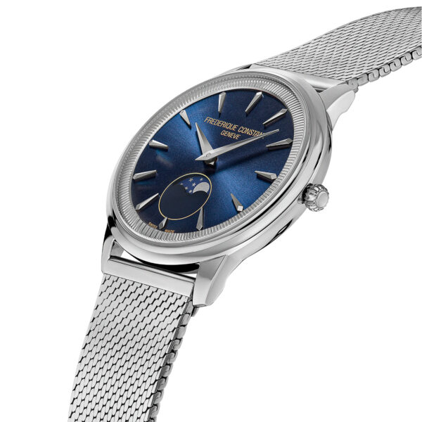 Die Frederique Constant Moneta Moonphase ist eine luxuriöse Armbanduhr mit blauem Zifferblatt, silbernen Stundenmarkierungen, Mondphasenanzeige und einem silbernen Metallband. Auf dem Zifferblatt steht "Frederique Constant Geneve".