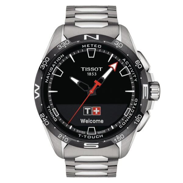 Die Tissot T-Touch Connect Solar ist eine Smartwatch mit schwarzem, rundem Zifferblatt, silbernem Metallband, einem digitalen Display mit der Aufschrift "T+ Welcome" und der Schweizer Flagge sowie einer Lünette, auf der die Himmelsrichtungen und verschiedene Funktionen angezeigt werden.