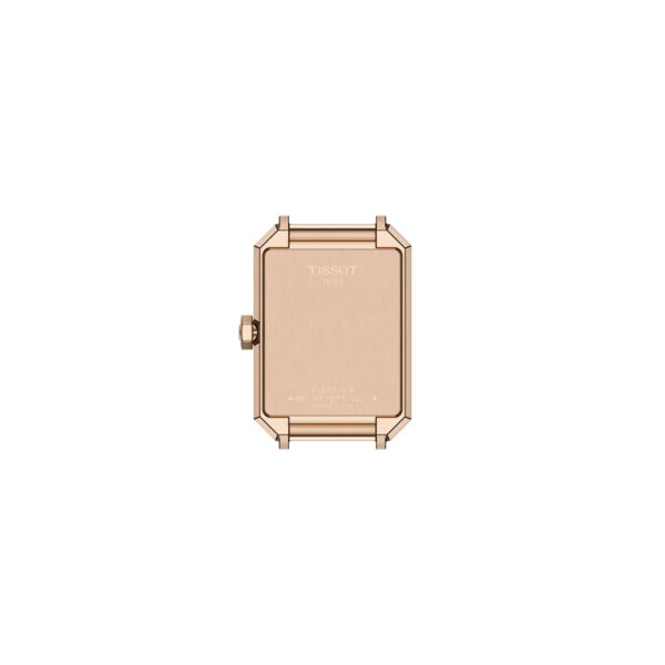 Die Tissot SRV 30MM verfügt über ein rechteckiges Gehäuse aus Roségold, das von der Rückseite aus sichtbar ist, mit einer Krone auf der linken Seite und eingravierten Markendetails auf der glatten Metalloberfläche.