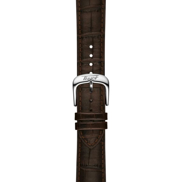 Ein braunes Lederarmband mit sichtbaren Nähten und einer silbernen "Tissot"-Gravur auf der Schließe, die für die Tissot Visodate 39MM entworfen wurde, ist vor einem weißen Hintergrund zu sehen.