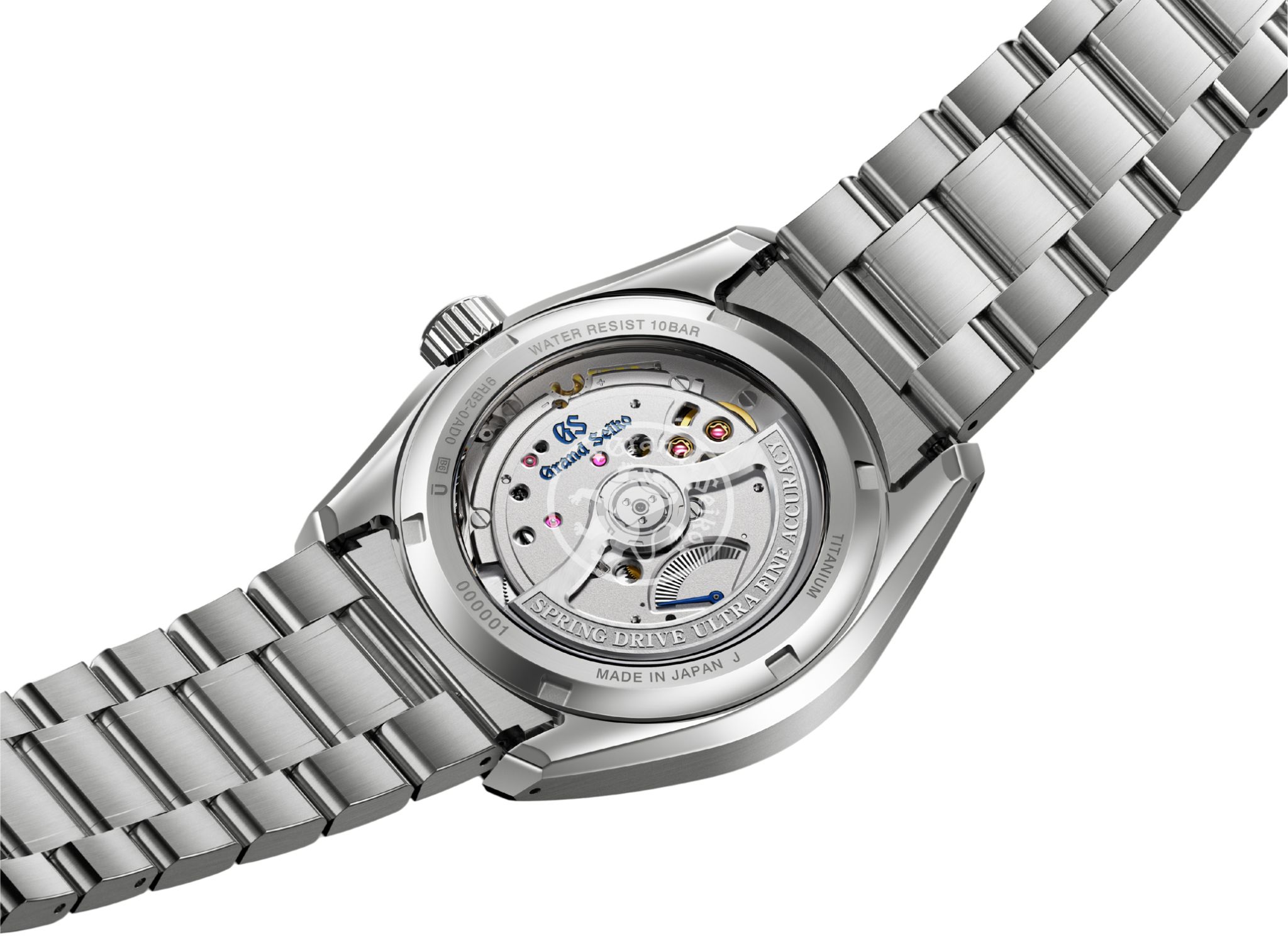 Eine Nahaufnahme der Rückseite der Armbanduhr „Grand Seiko Evolution 9 Lake Suwa Black“, die das sichtbare mechanische Uhrwerk sowie die gravierten Details am silbernen Gehäuse und Armband zeigt.